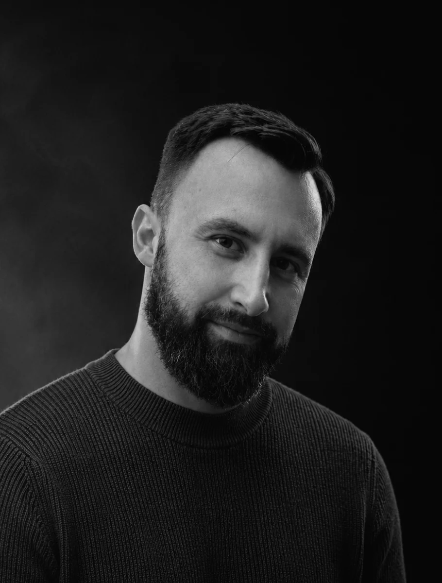 A black-and-white portrait of Adam Zdara.